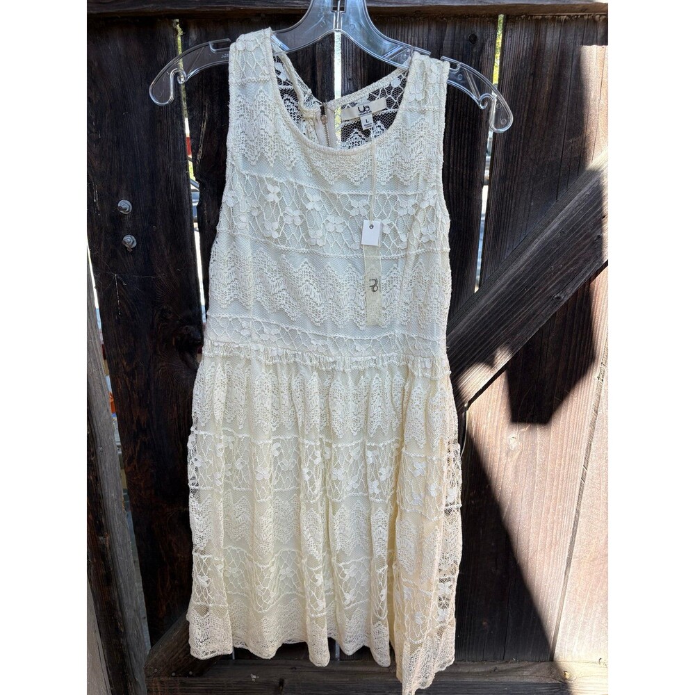 cream-colored, sleeveless boho-style lace dress